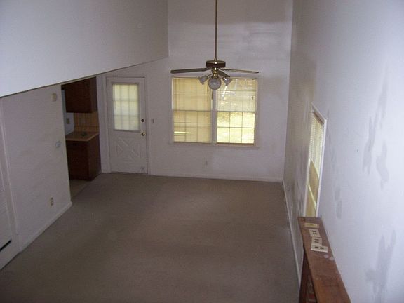 LIVING ROOM W/FIREPLACE AND BALCONY