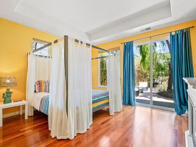 Primary Suite with fireplace and large slider doors to backyard
