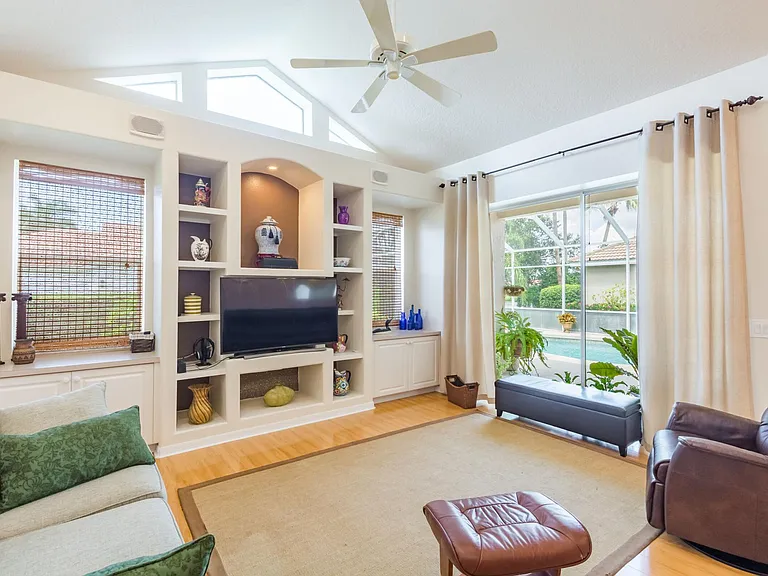 Family room with curved TV.