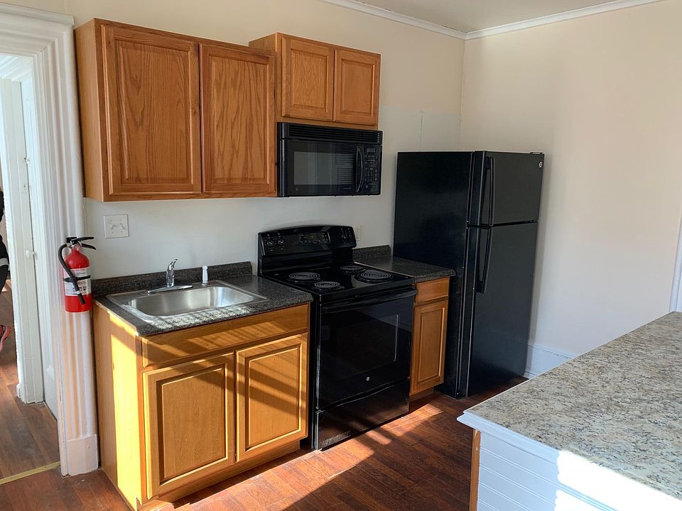 Kitchen has an over the range microwave, matching appliances.