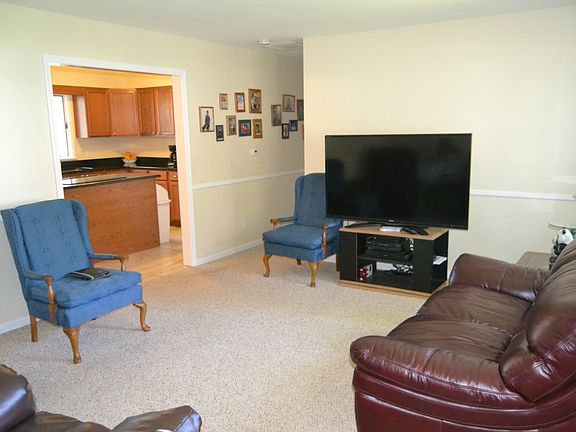 From the Living room you will have easy access to the main hallway leading the 3 bedrooms and is open to the eat in kitchen. 
