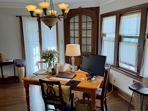 Formal dining room has french doors and built in corner china cabinet