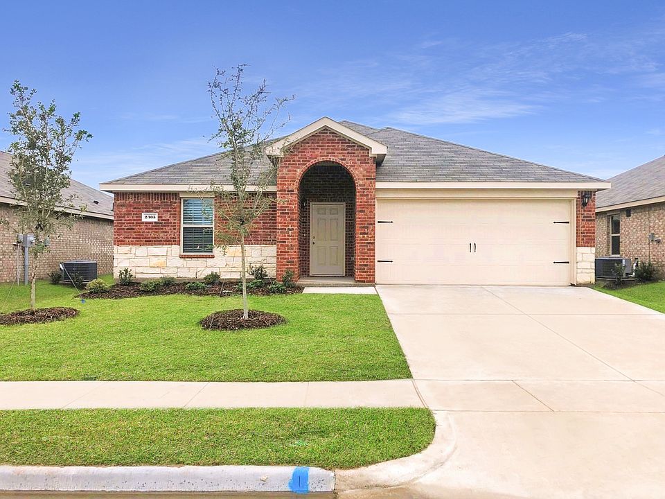 Front of home featuring covered porch and brick/stone exterior.
