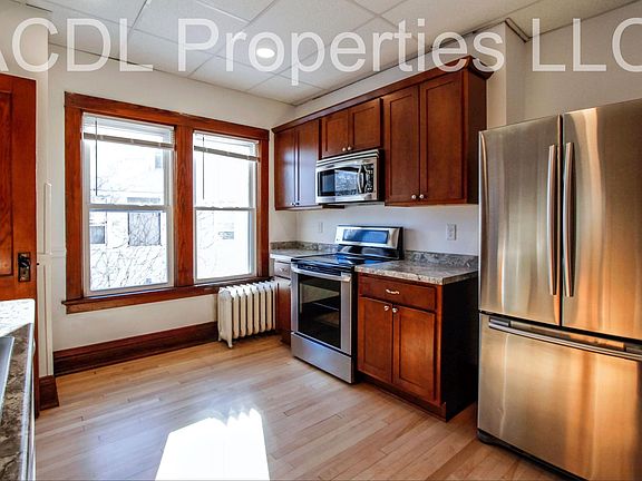 Updated kitchen includes stainless steel appliances, new cabinets, new countertops and walk-in pantry