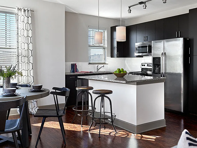 Chef inspired gourmet kitchens with Stainless Steel appliances and side-by-side refrigerator