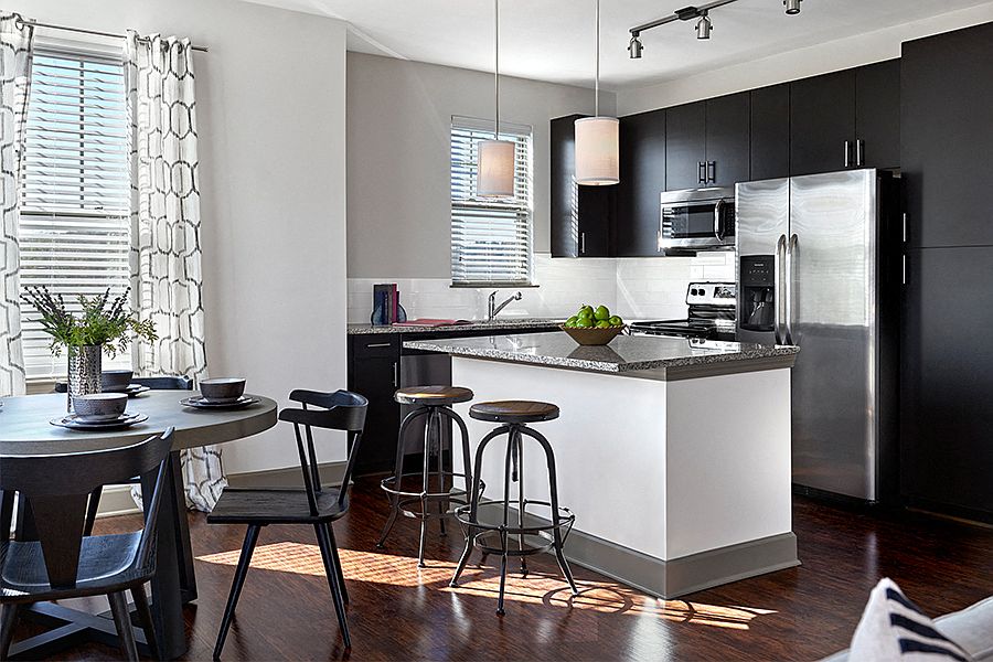 Chef inspired gourmet kitchens with Stainless Steel appliances and side-by-side refrigerator