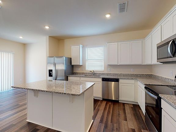 spacious kitchen with new stainless steel appliances