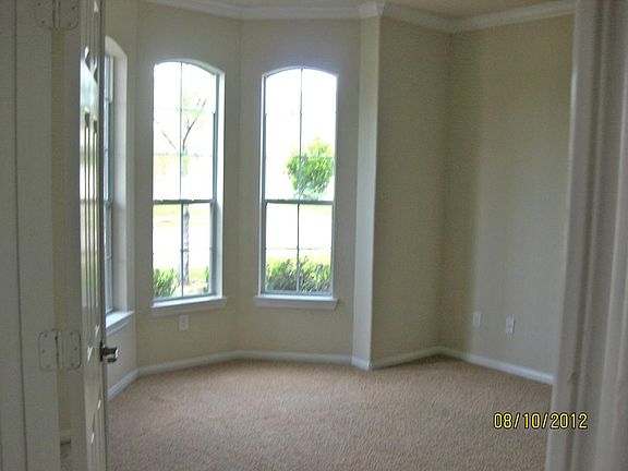 Study has Bay style windows and double doors