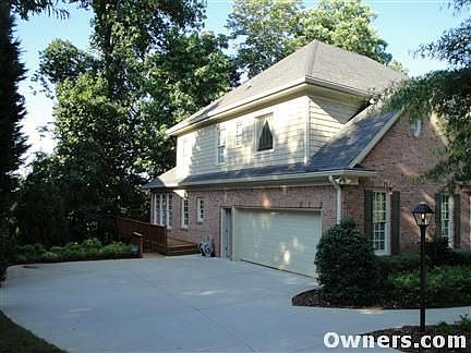 Large driveway with 2-car garage w/ door