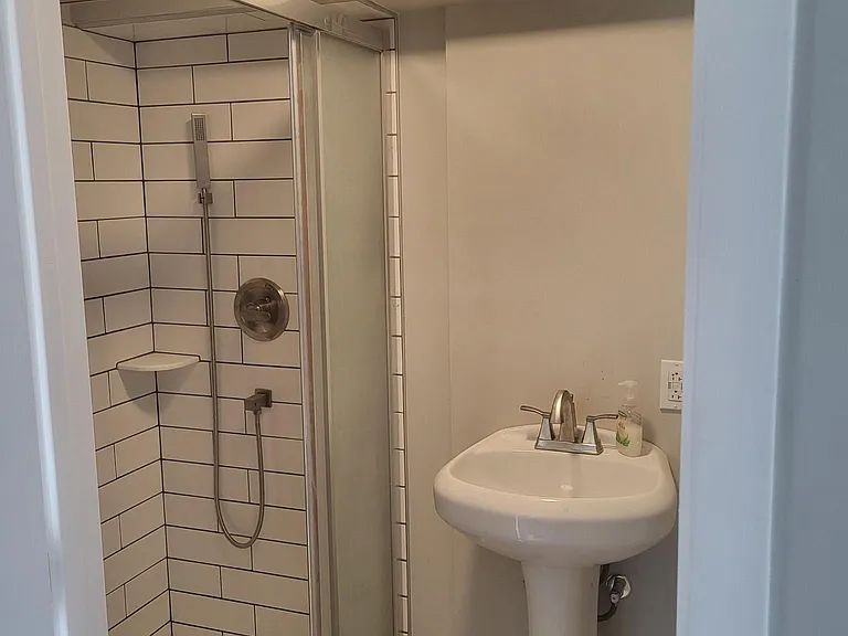 lower level full bathroom custom tiled shower