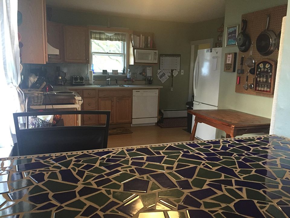 View of kitchen through dining room