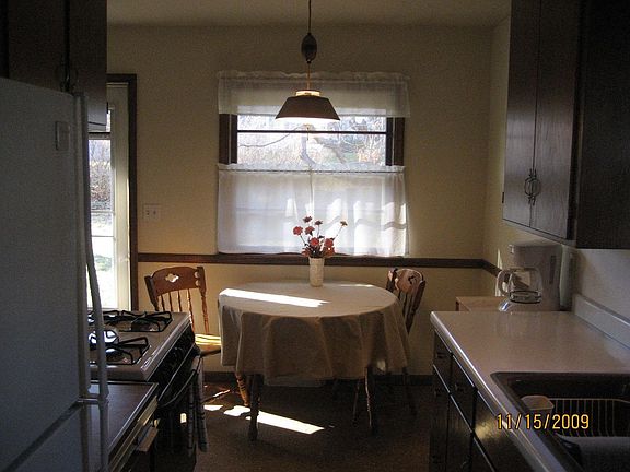 kitchen has original oak cabinets freshly refinished.
