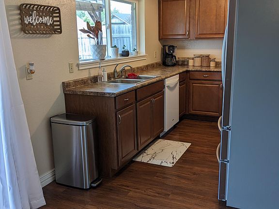 Kitchen with window overlooking backyard