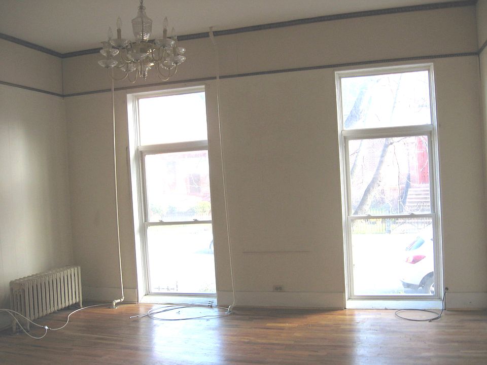 Living room, hardwood floors, floor to ceiling windows, chandalier light