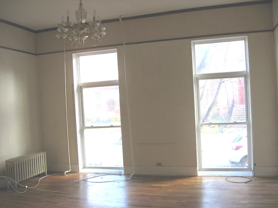 Living room, hardwood floors, floor to ceiling windows, chandalier light