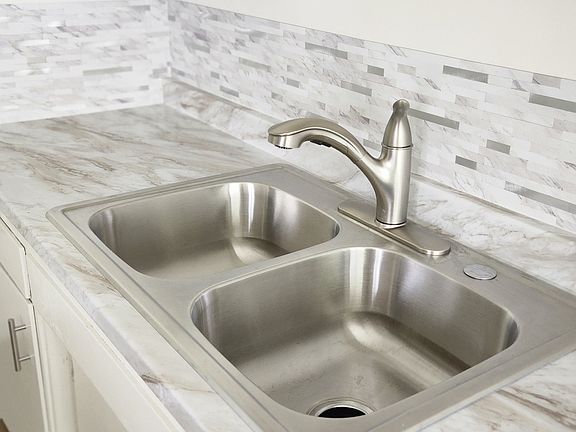 New sink, counter top with garbage disposal