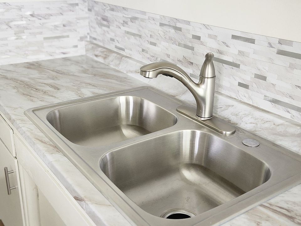 New sink, counter top with garbage disposal