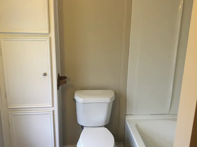 Freshly remodeled bath with new water saver toilet and tub/ shower combination.