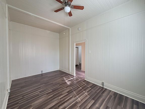separate living/ family room with ceiling fan naturally lit/ bright