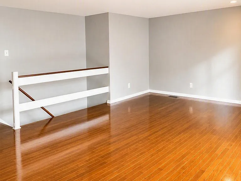 Living room with stairs to basement