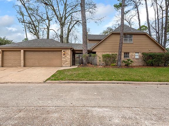 The 3 car detached garage has a wide driveway for easy access.