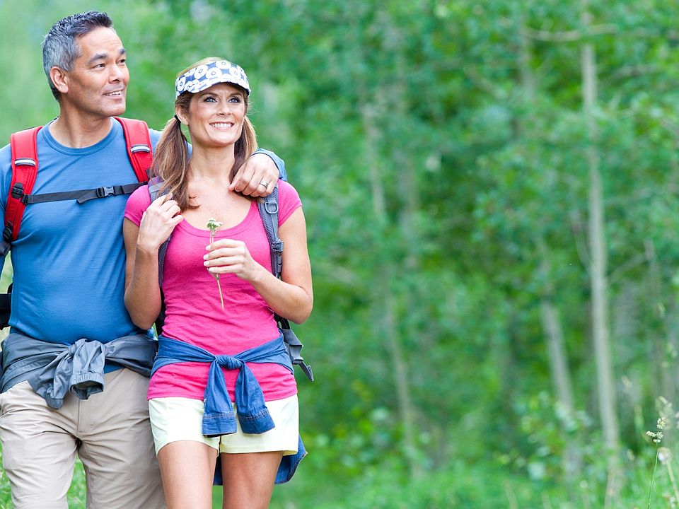 Couple enjoying a hike in the woods