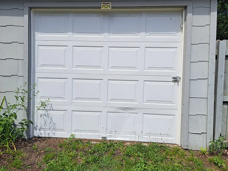 Private secure garage with cement floor.