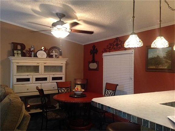 Open breakfast room with large window to view the property.  Bar lighting and more.