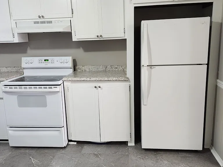 Another view of the renovated kitchen & appliances.