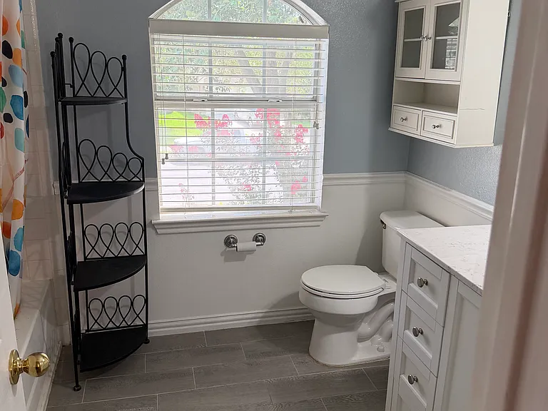 Upstairs Hallway Bathroom. Very spacious. Great for a shared bathroom or guest bathroom. Bathtub on left.