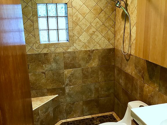 Copper slate tiled walk-in shower