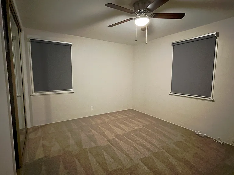 Front bedroom gets great natural light (ceiling fan has been modernized since this photo)