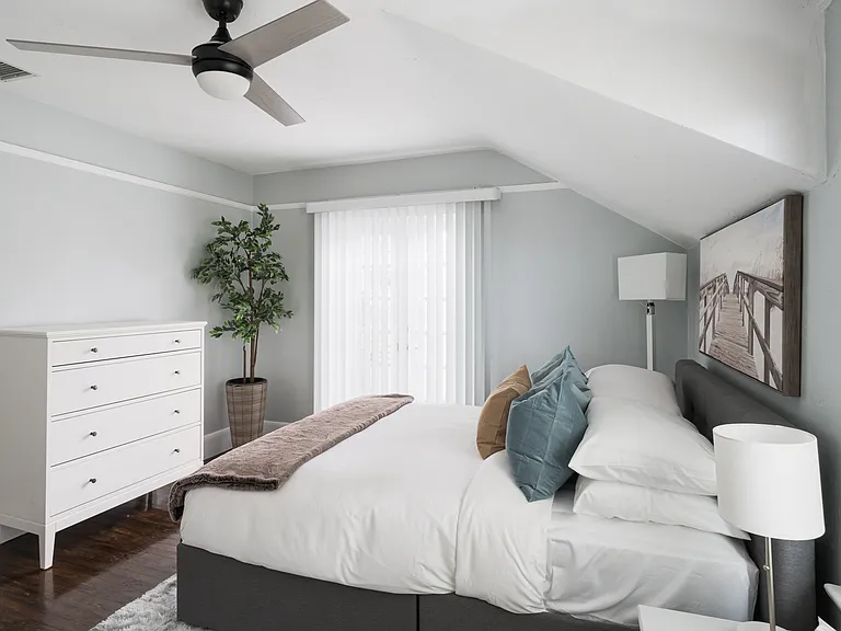 Bedroom 1 - queen size bed with French doors leading to private balcony.