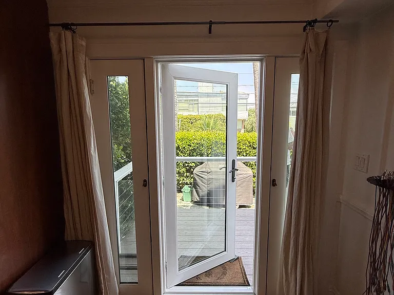 Door to deck and private yard off dining area