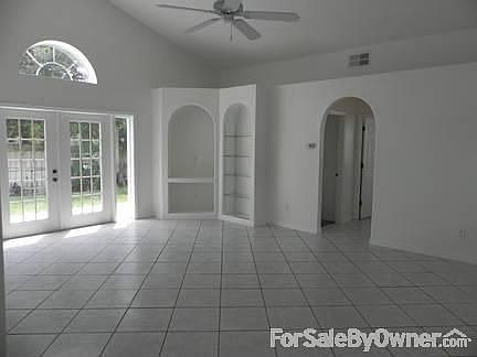 Great Room : French doors open to the back yard. Hall leads to 2 BR's and guest bath.