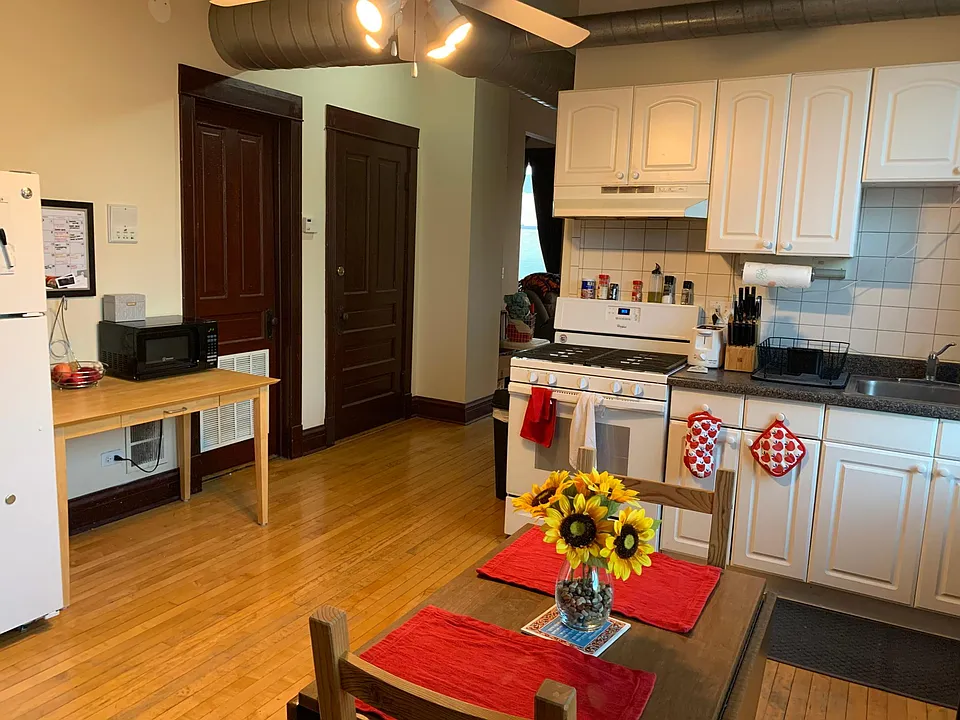 Kitchen with view of front door and hallway to family room