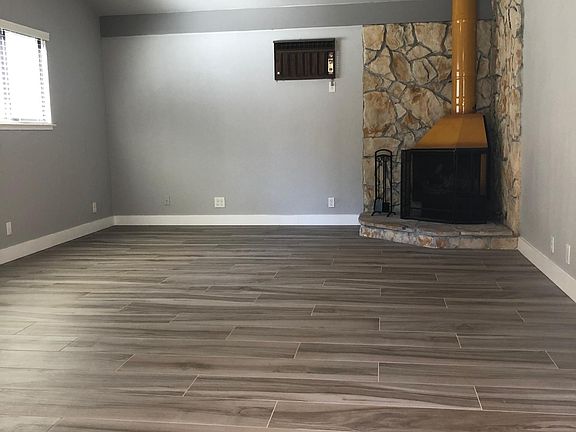 Remodeled family room with cozy wood burning stove