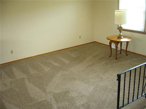 Spacious living room, new carpet and open to the dining room.