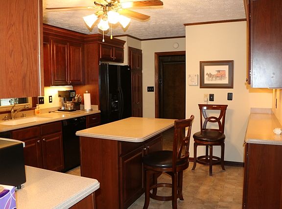 lots of cabinets and island