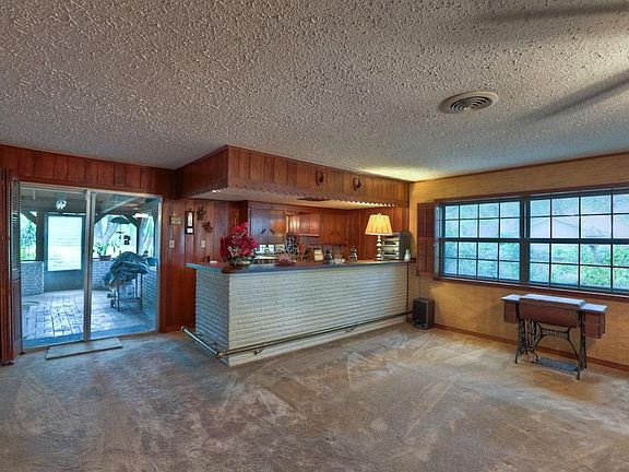 Family room with a bar area great for entertaining.