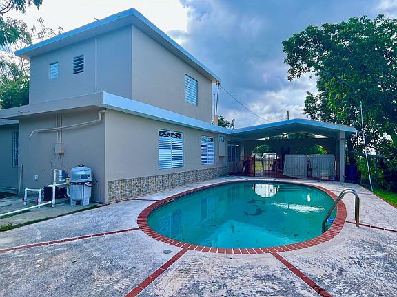 Full view of Pool and terrace. At second level private studio apartment.
