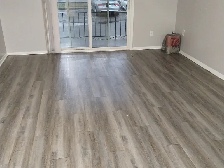 Living room of one of the 2-bedroom / bathroom units with a patio/balcony.
