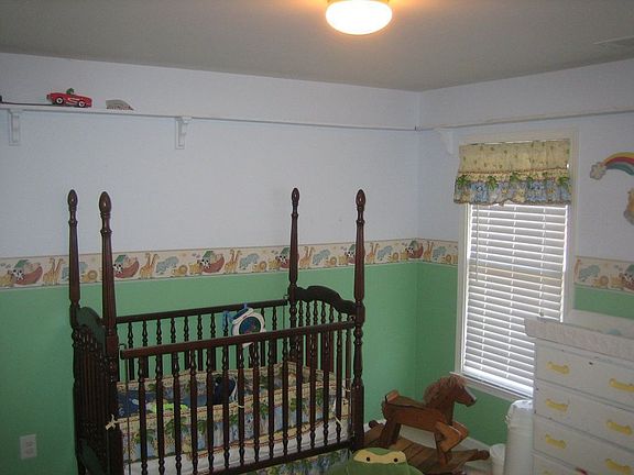 Beautiful Noah's Ark Nursery with wrap-around shelf ready for your little one.