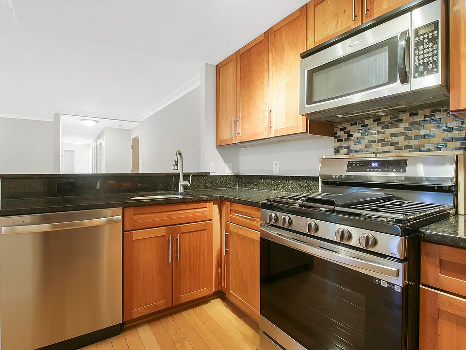 Kitchen with breakfast bar, behind sink