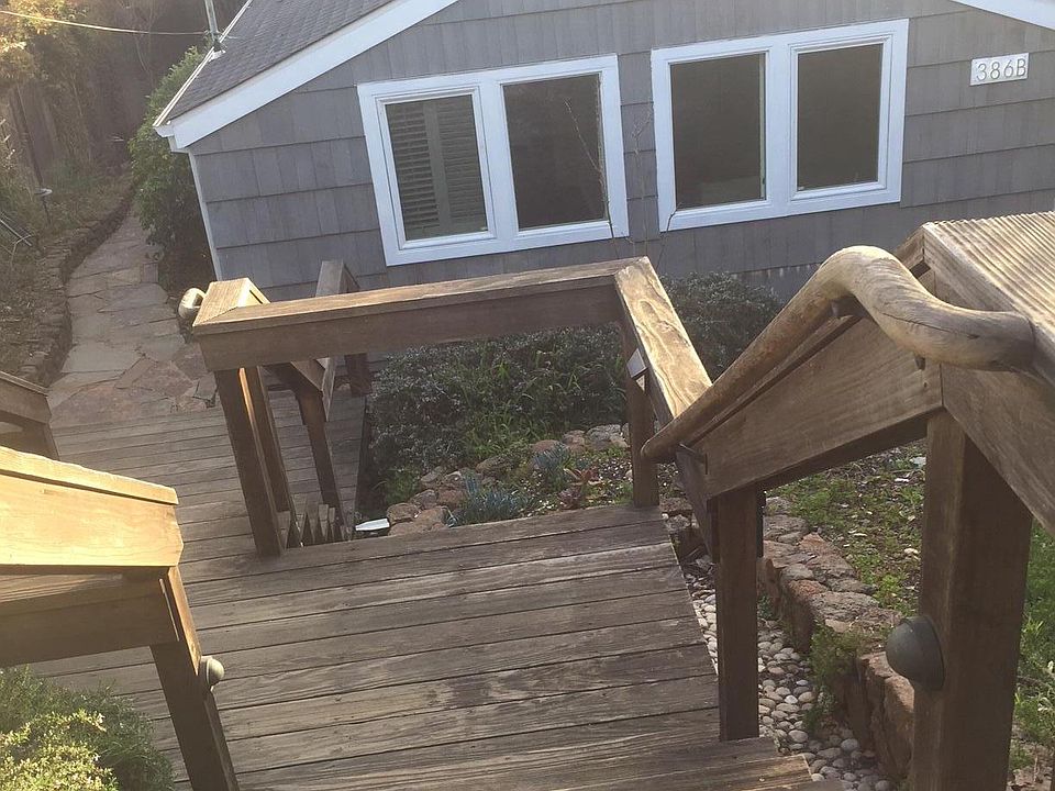 Steps from street down to cottage