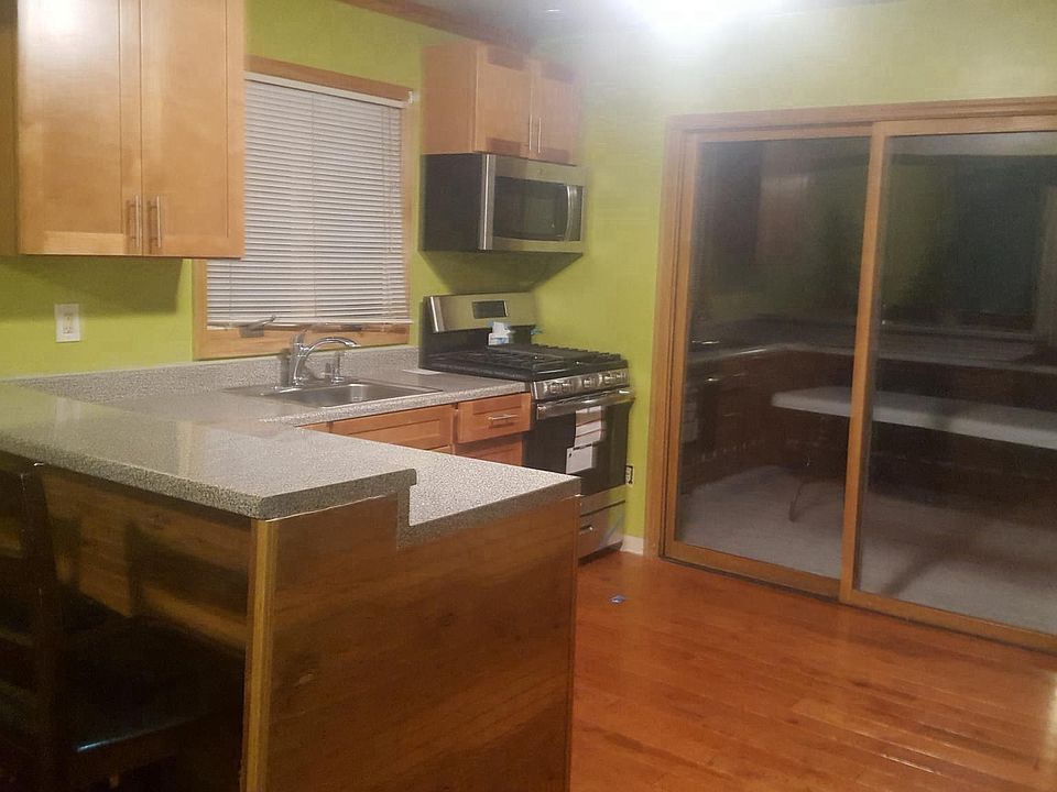 KITCHEN WITH BAR TOP - Hardwood floors thru  out home