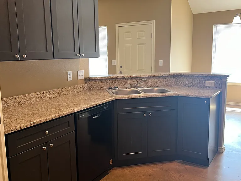 Kitchen view from garage entrance.