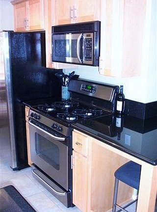 Remodeled kitchen w/slab granite counters
