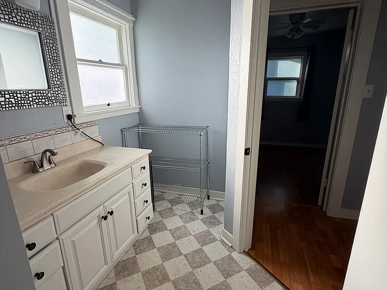 View from the bathroom looking toward the bathroom door.