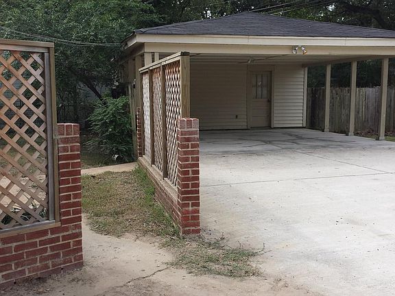 Carport leads to patio and back of house